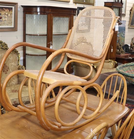 A caned bentwood rocking chair
